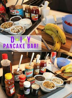 there are many different types of food on the counter top, including bananas and other condiments