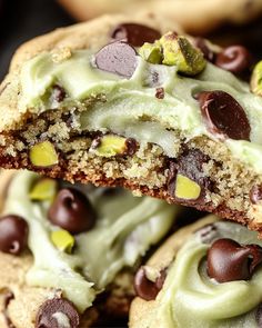 chocolate chip cookies with green frosting and pistachios are stacked on top of each other