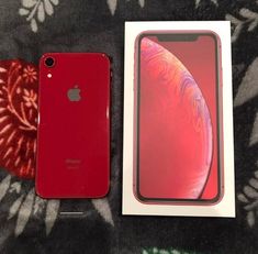 an apple iphone xr in its box and it's next to the package