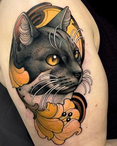 a black cat with yellow eyes and horns on its head is shown in this tattoo design