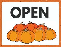 an open sign with pumpkins in front of it and dots on the bottom half