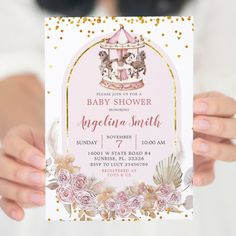 a person holding up a pink and gold princess baby shower card with flowers on it