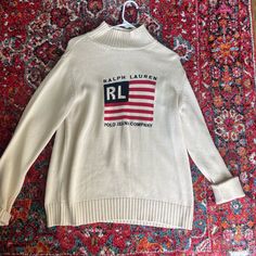 Polo Ralph Lauren American Flag Cream Sweater, Size Medium. Iconic Rare Piece.Small Pull And Very Faint Stain As Pictured But In Great Condition (Haven’t Tried To Remove Stain, Will Probably Come Out With A Tide Pen And A Wash) Tide Pen, Polo Ralph Lauren Sweater, Polo Jeans, Cream Sweater, Ralph Lauren Sweater, American Flag, Polo Ralph, Sweater Sizes, Polo Ralph Lauren