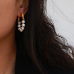 If you are looking for some earrings that goes well with simple black t-shirt but also make you stand out on a girls party, then our Eternity Pearl Hoop Earrings is here for you. Plated with 18k gold, the earrings feature two strands of freshwater pearls; they will definitely make a set with our Pearl Toggle Bracelet and Pearl Toggle Necklace. 18k gold plated Brass base Freshwater pearls Gold Pearl Drop Cartilage Earrings, Trendy Single Hoop Pearl Earring, Trendy Everyday Pearl Drop Earrings, Trendy Single Pearl Earring For Everyday, Trendy Pearl Drop Earrings For Everyday, Minimalist Single Huggie Earring For Party, Toggle Necklace, Toggle Bracelet, Pearl Hoop Earrings