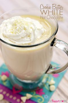 a close up of a cup of hot chocolate with whipped cream