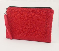 Handmade evening bag / clutch in red lined cotton fabric and red floral lace with removable wrist handle. The inner fabric is also made of red cotton and the bag can be closed with a zipper. Dimensions approx: 25 cm x 18 cm Red Evening Bag, New Year's Eve Wedding, Red Clutch, Evening Clutch Bag, Wrist Strap, Clutch Handbag, Red Floral, New Year's, Floral Lace