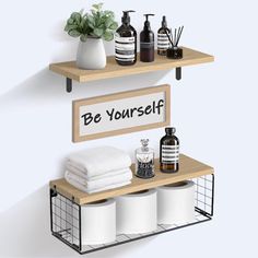 two shelves with towels, soaps and other items on them that say be yourself