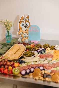 an assortment of food sitting on top of a table