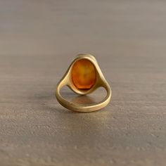 Mined and cut in New Jersey, this hypnotic amber-toned carnelian is gorgeously framed in honey yellow gold. 18k yellow gold Carnelian, 6.12ct, 9mm x 15mm (3/8" x 5/8") Cast Rings, Honey Yellow, Carnelian Ring, Newport Ri, Newport, New Jersey, Vintage Inspired, Amber, Honey