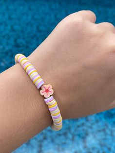 clay bead bracelet, jewelry, flower,pink, yellow, white, preppy, summer vibes Pink Flower-shaped Friendship Bracelets For Beach, Yellow Flower Bracelets For The Beach, Yellow Flower Bracelets For Beach, Pink Flower Friendship Bracelets For Beach, White Flower Bracelets For Vacation, White Beaded Bracelets For Spring Vacation, Yellow Flower Bracelet For The Beach, Cute Flower Beaded Bracelets For Beach, White Friendship Bracelets For Spring Vacation