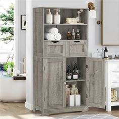 an open cabinet with bottles and soaps in it next to a rug on the floor