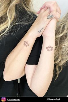 two women with tattoos on their arms and one has a crown tattoo on her arm