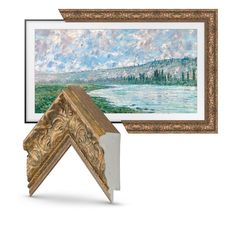 a painting hanging on the wall next to an open frame with it's reflection