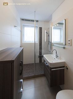 a bathroom with a sink, toilet and shower