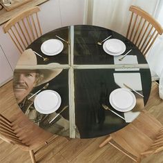 the table is set with plates, silverware and utensils for four people