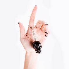 This black skull keychain is a unique, handmade masterpiece.

It is created using a high quality black pigment inside the resin skull keychain. Resin Skull, Skull Keychain, Black Pigment, Black Skull, Light Pull, Skull Necklace, Black Skulls, Fan Light, Amethyst Gemstone