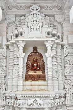 an intricately carved white and gold temple