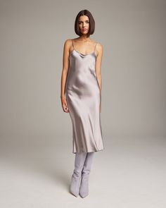 Bias cut Midi Slip Dress elegantly drapes on the body. This perfect basic can be worn for life, dressed up, or dressed down, for the perfect ensemble. Style with a sweater and boots in the Fall or wear with sandals in the Summer. 100% Silk Charmeuse Made in New York City Product Care: Dry Clean Only Bias Cut Evening Dresses For Fall, Elegant Bias Cut Fall Dresses, Chic Winter Silk Dresses, Sleek Silk Dress For Fall, Sleek Silk Fall Dresses, Elegant Fall Party Slip Dress, Fitted Bias Cut Dresses For Fall, Fall Season Slip Dress For Night Out, Fall Slip Dress For Night Out