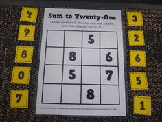 a sud puzzle with numbers on it and yellow tags around the edges that read sum to twenty - one