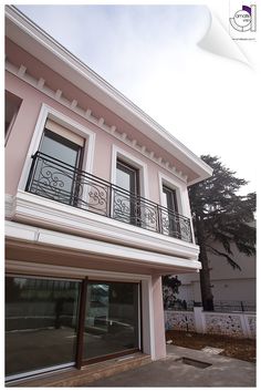 an apartment building with balcony and balconies