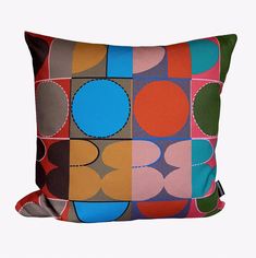 a multicolored pillow with circles on it