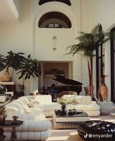 a living room filled with furniture and a grand piano