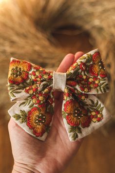 Add a touch of autumn charm to your hair with this exquisite linen hair bow in fall colors. Featuring intricate floral embroidery and delicate beads, this hair accessory will elevate any outfit with its unique and elegant design. Perfect for adding a pop of color and texture to your look, this hair bow is a must-have for any fashion-forward individual. Handcrafted with care and attention to detail, this piece is sure to become a favorite in your accessory collection. The size of this embroidered hair bow is approximately 5 '' x 4'' (13 cm x 8 cm). The hair bow is attached to alligator hair clip, which is very easy to put on any hairstyles. The bow will be packed in a nice eco friendly packaging and will be sent with the tracking number of the parcel. Delivery usually takes about 14 days. I Embroidered Hair Clips, Embroidery And Beads, Embroidered Hair Bows, Handmade Hair Accessories, Beads Handmade, Girls Bows, Fall Floral, Hair Accessory, Barrettes