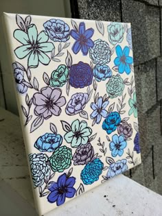 a painting with blue and purple flowers on it