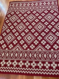 a red and white rug on the floor