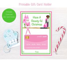 a pink and green gift card with candy cane