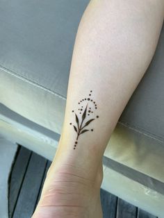 a person with a small tattoo on their arm