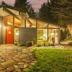 a small house is lit up at night