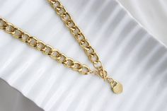 "Cuban link chain Gold plated heart padlock necklace for women. This heart necklace is perfect for yourself or for a special occasion gift. A beautiful and delicate stainless steel necklace, this is the perfect gift, it is minimalistic and adds a subtle touch and style. It is a beautiful detail that makes every romantic woman fall in love. ITEM DETAILS: Necklace Length: 17\" Necklace Weight: 3.1oz Material: Stainless Steel * JEWELRY CARE* Keep your jewelry dry. Apply makeup and hairspray before Chunky Heart Pendant Chain Necklace In Metal, Chunky Heart Pendant Metal Chain Necklace, Chunky Chain Heart Pendant Necklace, Gift Chain Necklace Choker, Heart Pendant Chain Necklace In Gold Metal, Trendy Curb Chain Necklace For Gift, Cuban Link Necklace With Adjustable Chain For Gift, Gold Plated Jewelry With Chain Strap For Gift, Everyday Gold Chain Necklace With Heart Pendant