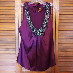 Color Is Currant Deep V Neckline Is Heavily Embellished Size Small Sleeveless Embellished Tops For Night Out, Embellished Blouse For Night Out, Purple Embellished Sleeveless Top, Formal Sleeveless Embellished Top, Elegant Purple Festive Top, Elegant Purple Top For Festive Occasions, Elegant Festive Purple Top, Womens Silk Shirts, Mock Neck Blouse