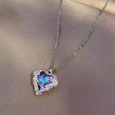 Exquisite Crystal Heart With Simulated Diamond Side Stones. Stainless Steel 17.7” Chain With Pear Clasp. Crystal Heart Pendant, Metal Necklaces, Stainless Steel Necklace, Crystal Heart, Daughter Gifts, Steel Jewelry, Stainless Steel Jewelry, Heart Pendant Necklace, Chains Jewelry