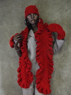 a mannequin wearing a red scarf and hat