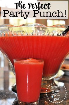 a red drink sitting on top of a table