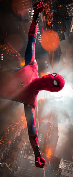 spider - man flying through the air with his arms outstretched in front of buildings and fire