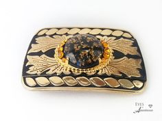 "Gold belt buckle Real gold flakes 24 karat gold gift for him gift for her Western belt buckle with gold and black belt buckle gold bling Western belt buckle made with genuine real, 24 karat pure, gold  flakes that are encapsulated in a vintage ( new ) resin cabochon Great gift for him or her...it's UNISEX in design! This one - of -a- kind Western themed belt buckle has golden vintage rhinestones on either side of the centerpiece. The rectangular gold plated buckle has a striking pattern and is Collectible Antique Gold Belt Buckles, Luxury Gold Belt With Antique Buckle, Gold Antique Buckle Vintage Belt Buckles, Gold Belt Buckle, Luxury Black Belt Buckles With Gold-tone Logo, Luxury Black Belt Buckles With Gold-tone Hardware, Western Belt Buckles, Gold Belts, Western Belts