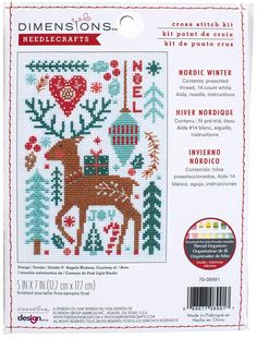 the cross stitch kit for christmas is shown