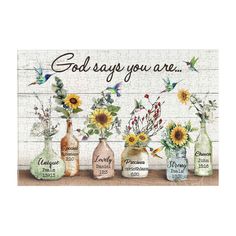 four vases with sunflowers in them and the words god says you are