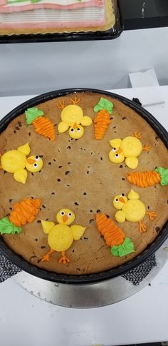 a cake decorated to look like chickens and carrots