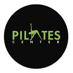 the pilates center logo is black and green, with a silhouette of a woman doing