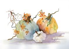 three pumpkins with flowers on them are painted in watercolor and then have leaves