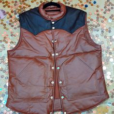 Choco 100% Lamb Leather Silk Lining Leather Winter Vest With Pockets, Fall Denim Vest With Snap Buttons, Fitted Brown Outerwear For Outdoor, Fitted Leather Winter Vest, Fitted Winter Vest With Snap Buttons, Fitted Brown Outerwear With Snap Buttons, Brown Fitted Outerwear With Snap Buttons, Outdoor Fall Vest With Padded Collar, Fall Outdoor Vest With Padded Collar