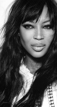 a black and white photo of a woman with long hair