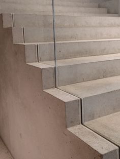 concrete steps leading up to the top of a cement building with no people on it