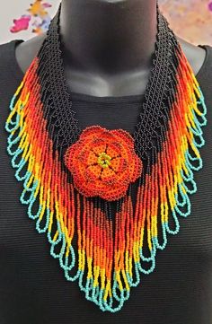 "This one of a kind necklace is handmade by a female artist in Sololá, Guatemala. The flower motifs used in Mayan tradition are usually the native flowers of Guatemala. They bloom abundantly throughout the year and are symbols of life and fertility. The necklace is adjustable and the total length is 12\" from the mid-top to mid bottom.  It is paired with matching earrings. The beads are imported glass Czech seed beads. The women who design and create these pieces are part of a Women's Collective who live in villages around Lake Atitlán in Guatemala. They gather in order to continue the traditions and teach the next generation about their heritage. Thank you for your support!" Symbols Of Life, Bold Statement Necklaces, Boho Style Necklaces, Native Flowers, Flower Motifs, Princess Necklace, Female Artist, Life Symbol, Leather Fanny Pack