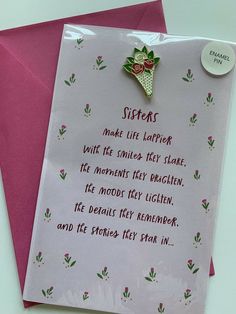 a pink greeting card with an ornament on it and a poem written in cursive writing