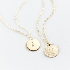 "This pendant necklace is a classic--and for good reason. Add a special initial or symbol (or leave it blank!) and wear every day, with everything. Every piece is handcrafted and hand-personalized with love in La Conner, WA, using 90% recycled and 100% ethically sourced raw materials from the USA--because it's better that way. Includes free gift-ready packaging (featuring a care card and traditional letterpress goodies made by my dad)!  MATERIALS: * Gold = 14k gold filled * Silver = sterling silver * Rose gold = 14k rose gold filled DETAILS: * 13mm disk * Hand-personalized with traditional metal punches AT CHECKOUT: * If you chose \"other\" for length, specify which length you'd like in a note. * Select expedited shipping (and add a note with your ideal delivery date) if you need your piec Classic Initial Necklace As A Gift, Classic Rose Gold Initial Pendant Name Necklace, Classic 14k Gold Initial Charm Necklaces, Classic 14k Stamped Initial Pendant Jewelry, Classic 14k Gold Initials Charm Necklace, Classic Round 14k Gold Name Necklace, Classic Initial Pendant Charm Necklace For Anniversary, Classic Necklaces With Initial Pendant For Anniversary, Classic Mother's Day Charm Necklaces With Initial Pendant